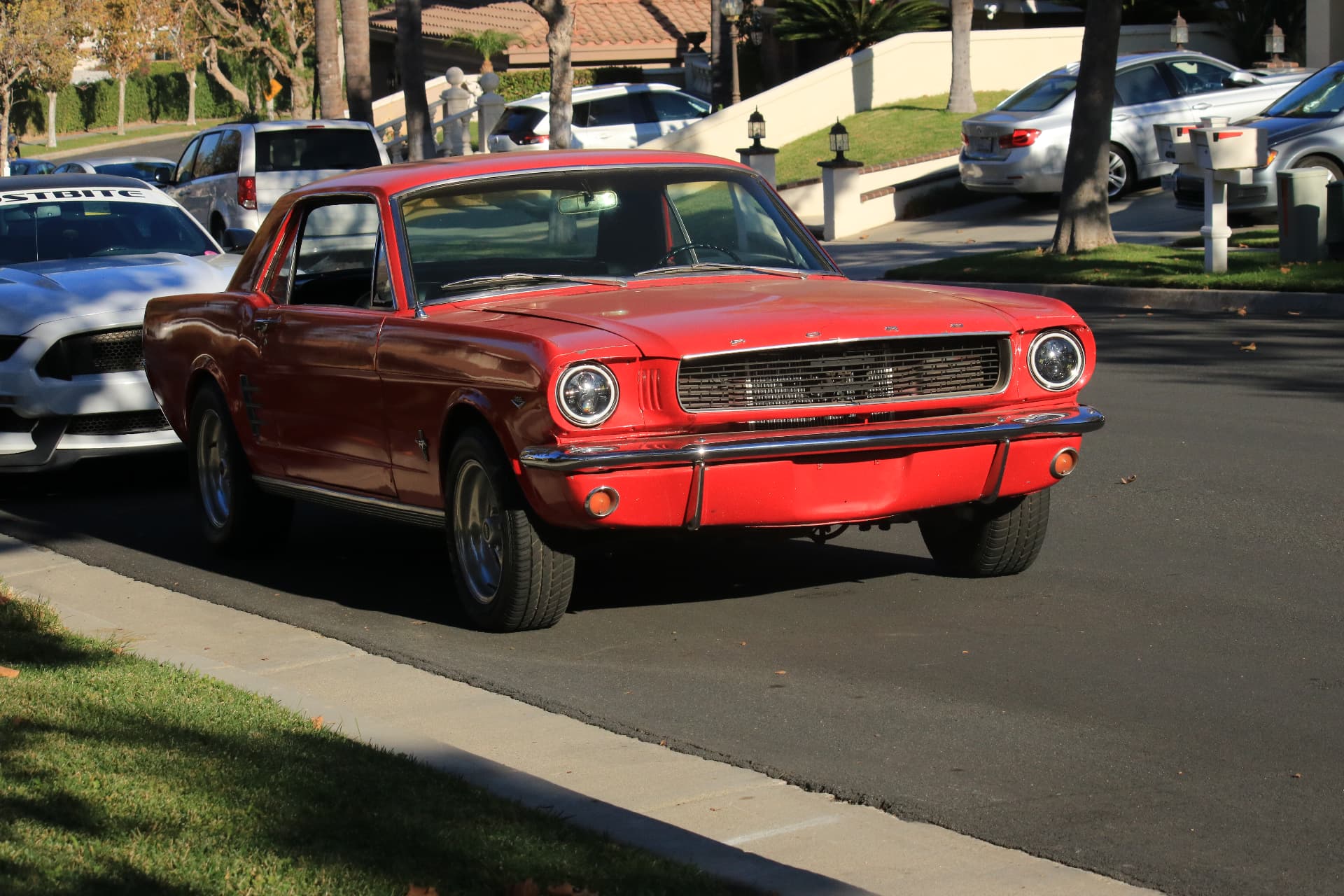 Front three-quarter view of the red 1966 Ford Mustang build